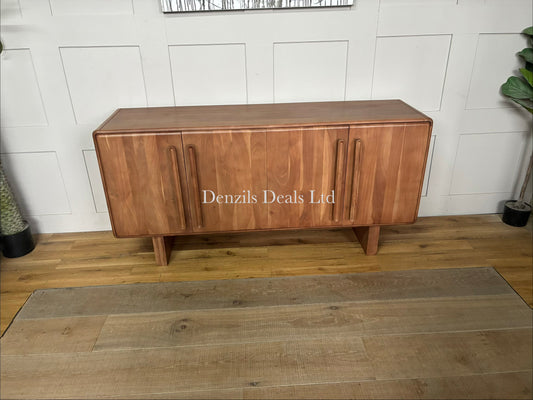 Natural acacia wood four-door sideboard with softly rounded edges, a vertical panelled design, and discreet cable holes at the back