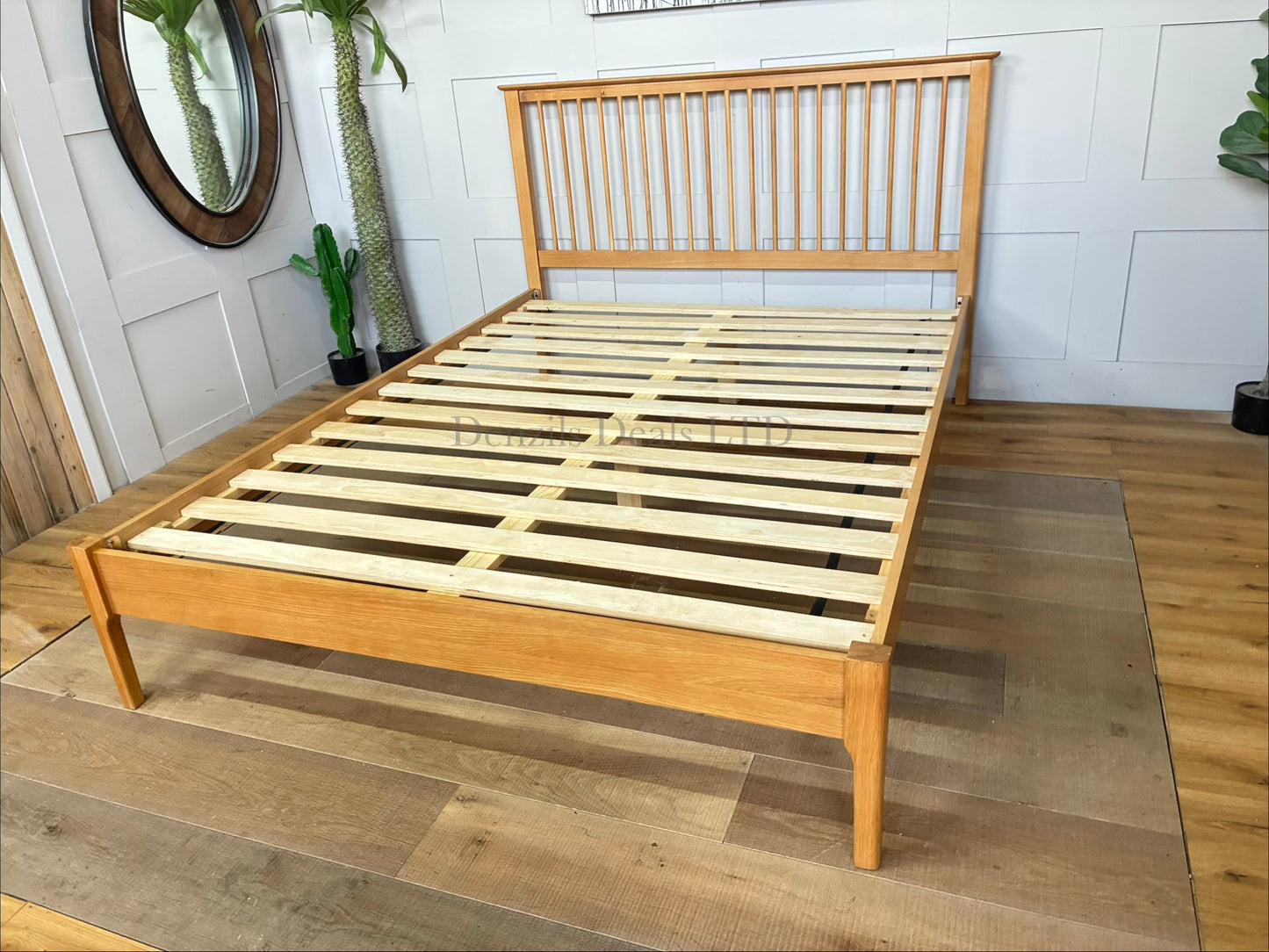 Natural solid oak king-size Julian Bowen Cotswold bed frame featuring a traditional Shaker-style slatted headboard and a low foot-end.