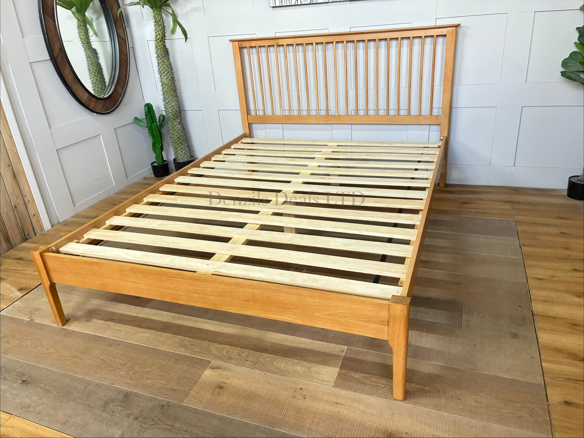 Natural solid oak king-size Julian Bowen Cotswold bed frame featuring a traditional Shaker-style slatted headboard and a low foot-end.