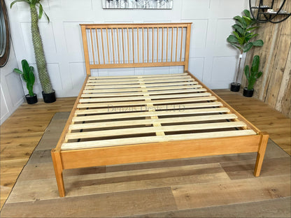 Natural solid oak king-size Julian Bowen Cotswold bed frame featuring a traditional Shaker-style slatted headboard and a low foot-end.