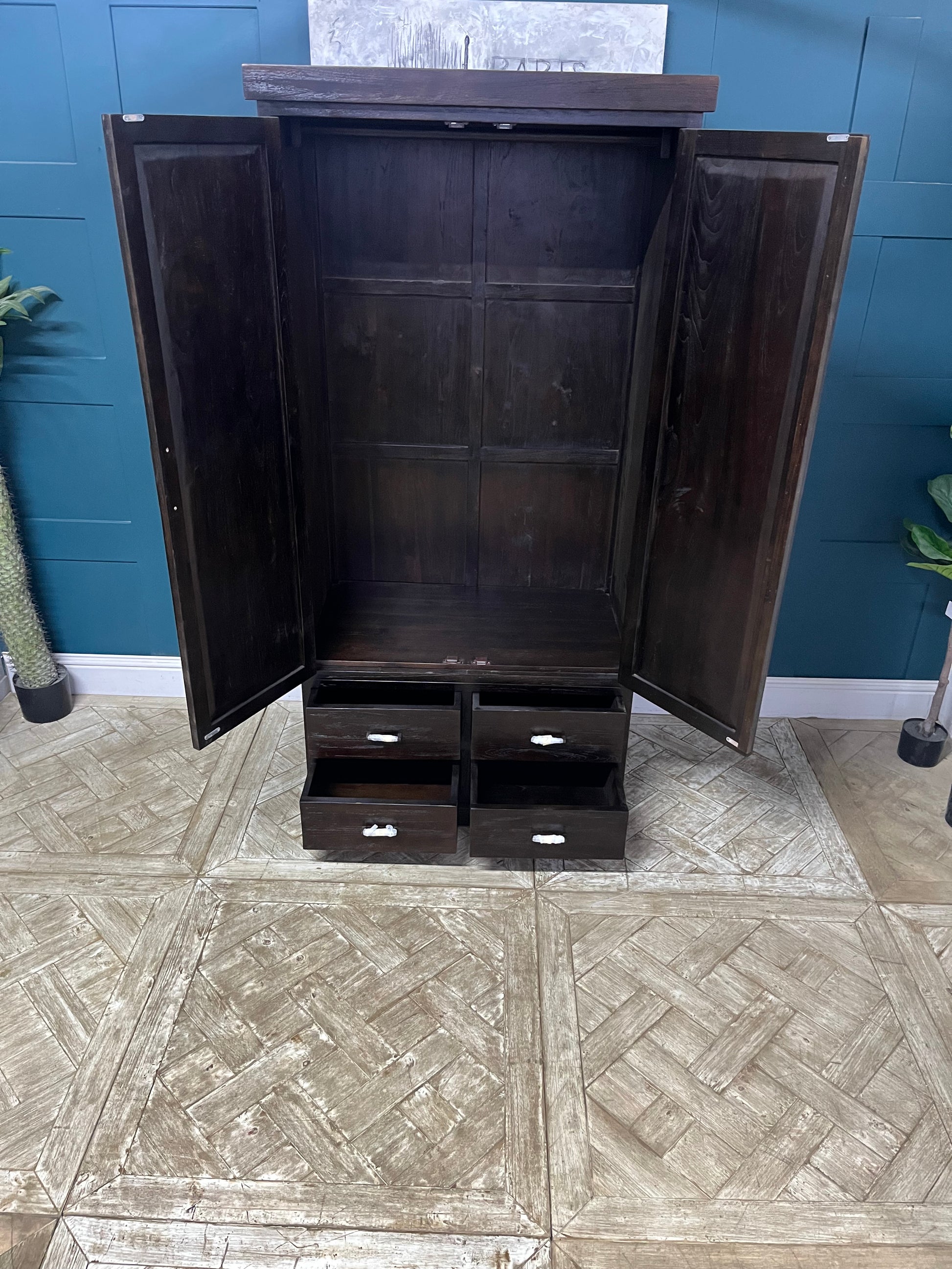 Natural teak triple-style wardrobe with two cabinet doors and three bottom drawers.