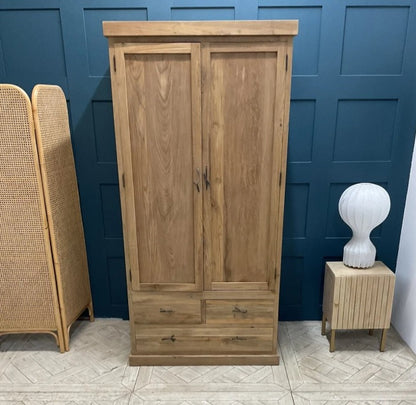 Natural teak triple-style wardrobe with two cabinet doors and three bottom drawers.