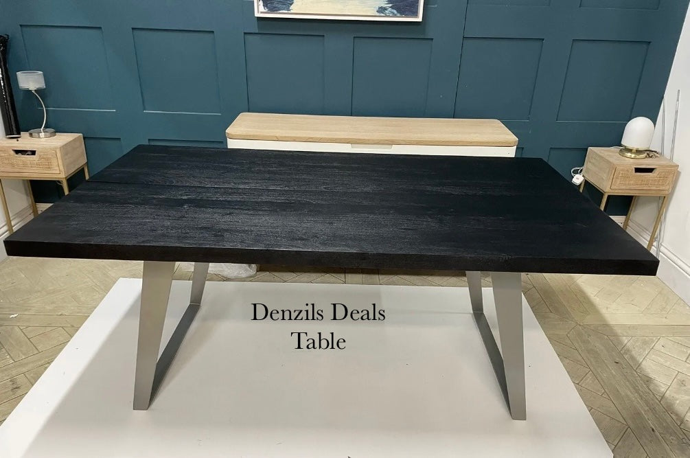Newington Black Dining Table (180cm) & Bench, Small By Gallary Direct
Solid black acacia wood top
Angular metal legs
Seat 4 - 6 people
