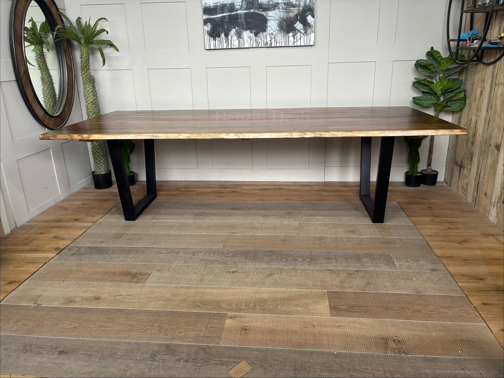 Rectangular Nick Scali Bartolo dining table with a live-edge Tasmanian Blackwood timber top and black metal sleigh legs.