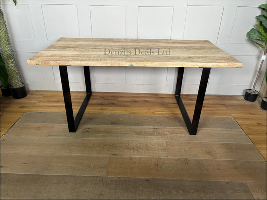 "Nkuku Fia 6-seater dining table with a natural mango wood tabletop and a dark, angular iron frame base