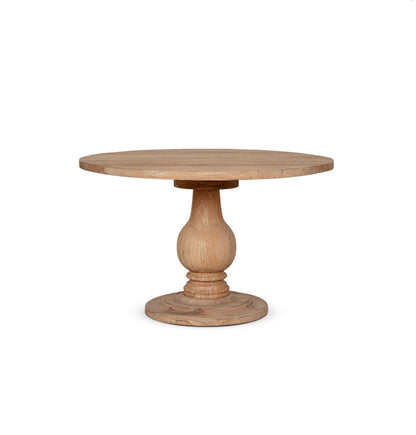Close-up of the Nkuku Laya table surface showing the natural blonde and beige grain patterns of sustainable mango wood with a smooth, matte finish."