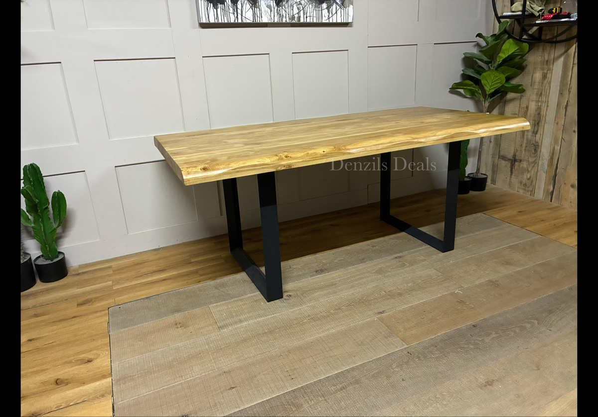 A rectangular Oak Furnitureland Brooklyn 8-seater dining table with a light natural solid oak top, organic wavy "live edges," and industrial dark metal legs.