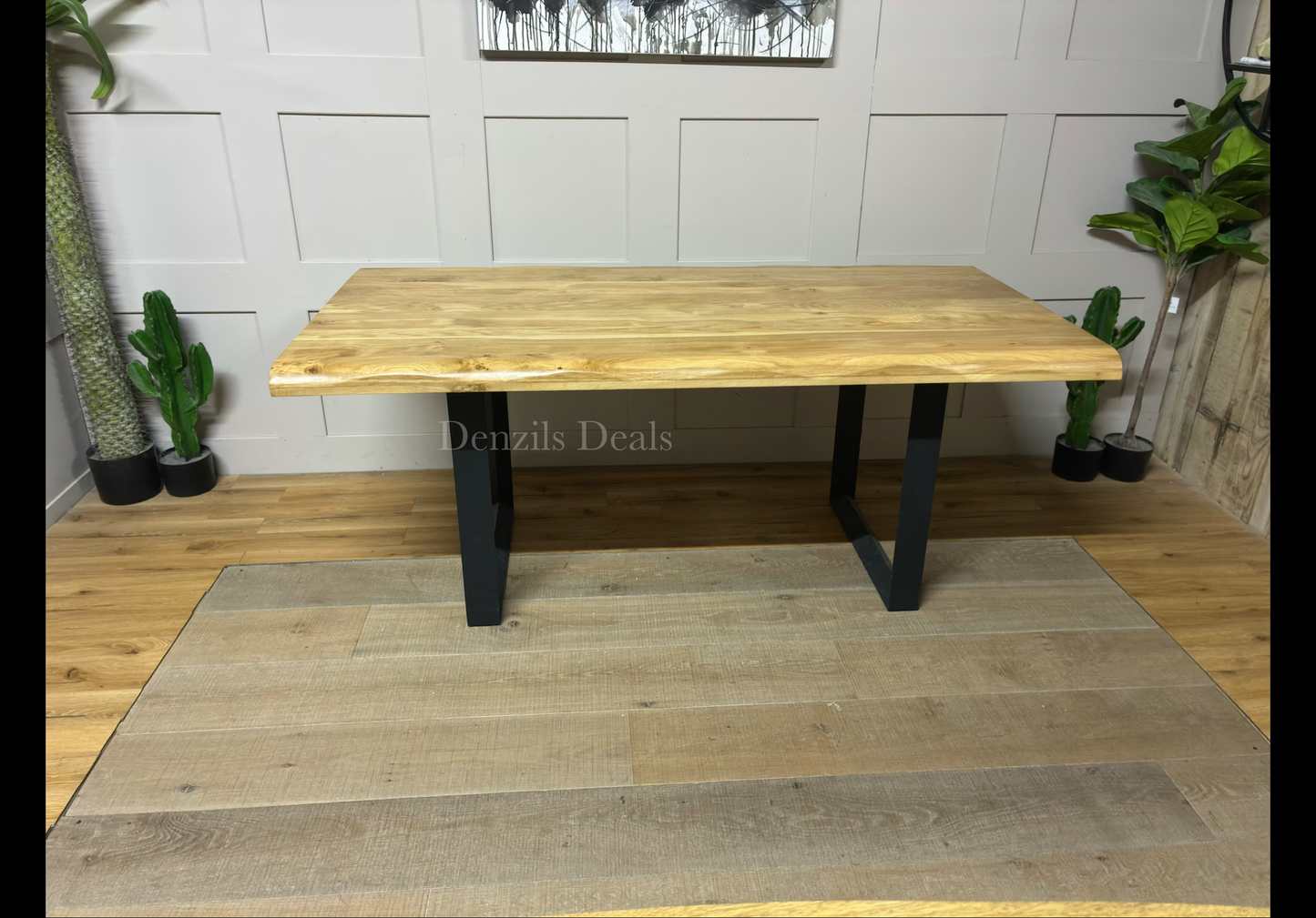 Oak Furnitureland Brooklyn 8-seater oak dining table with live edges and industrial metal legs.