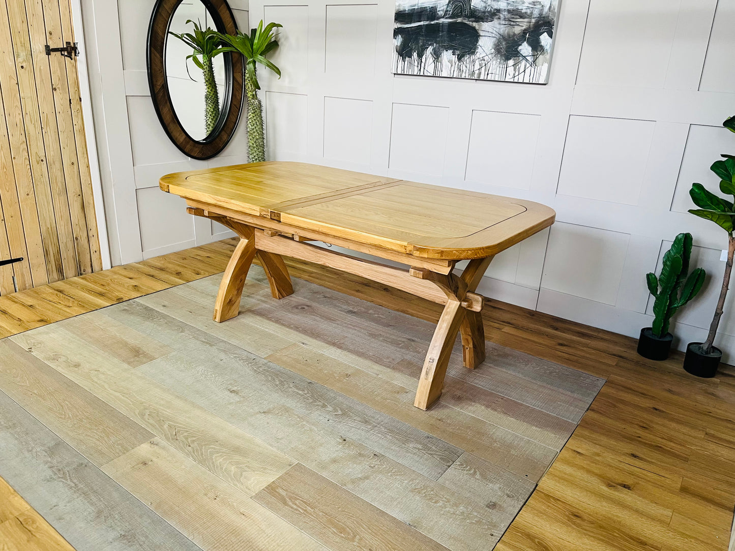 Oak Furnitureland Hercules 10-12 seater extending solid oak dining table.