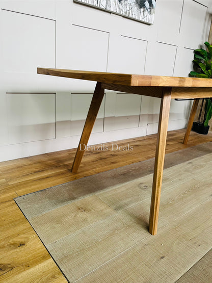 Oaklee solid oak dining table in modern living room showing Scandi-style furniture.
