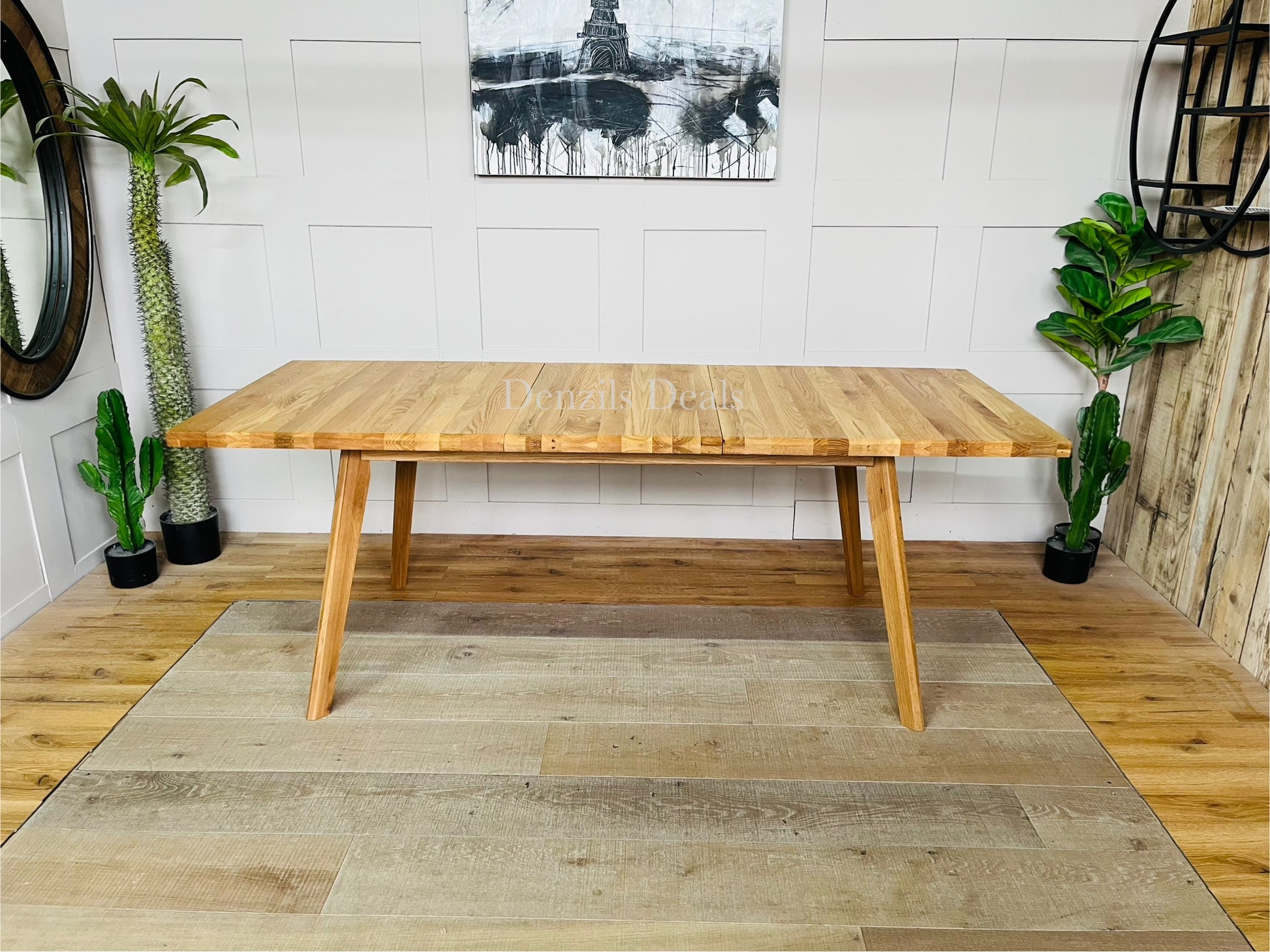 Oaklee solid oak dining table in modern living room showing Scandi-style furniture.