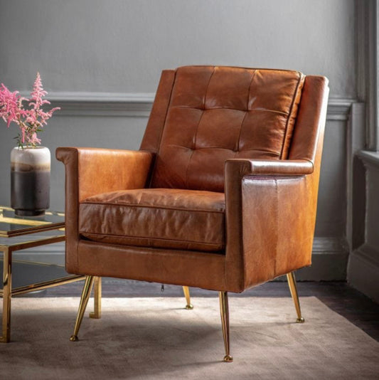 Pavilion Chic Saltford armchair in vintage brown leather with button detailing and slender gold metal legs"