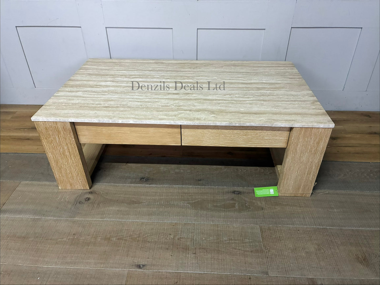Pottery Barn Travertine Coffee Table in Fog is a rectangular wooden and stone coffee table featuring a neutral fog finish and travertine stone accents