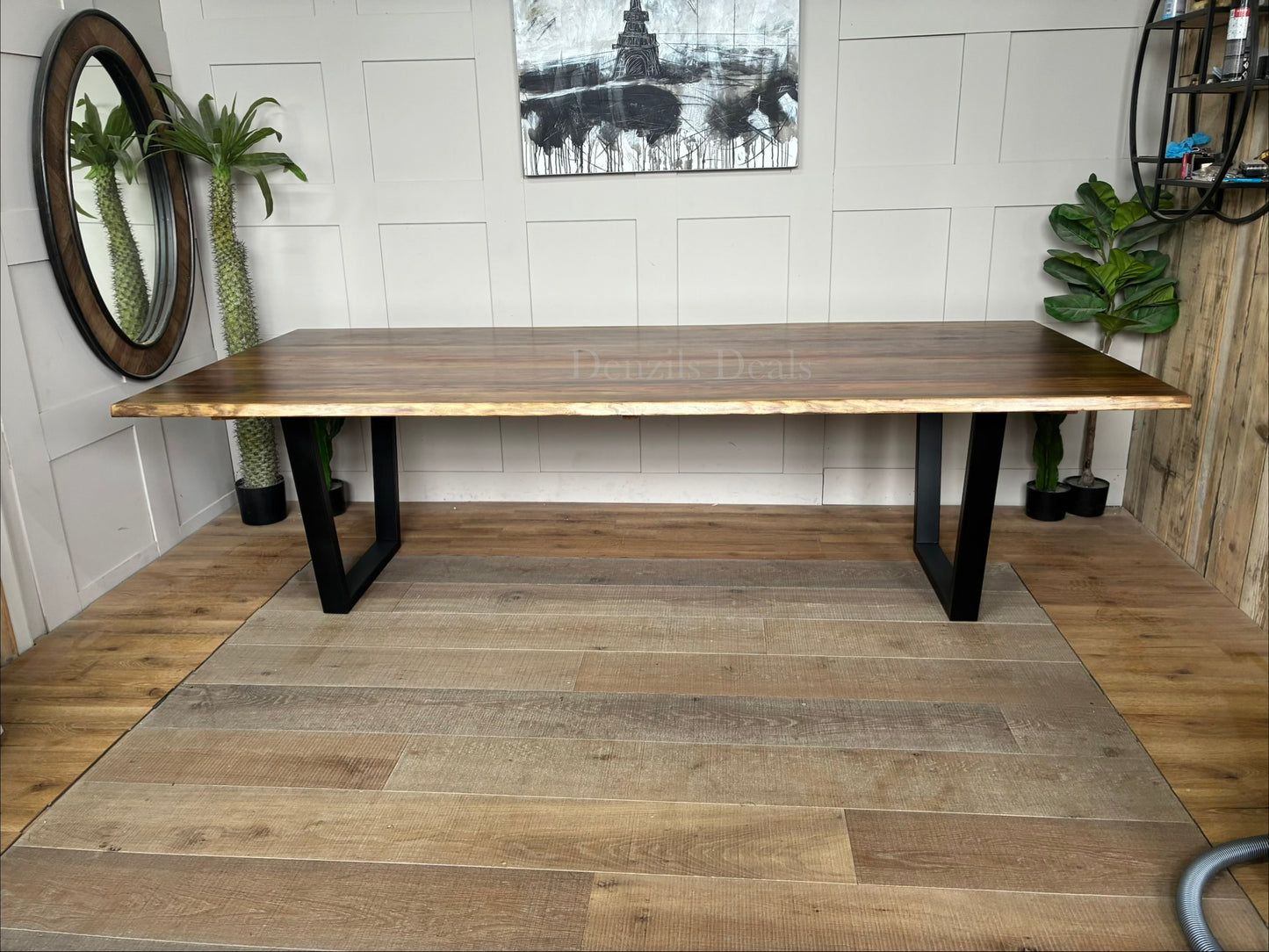 Rectangular Nick Scali Bartolo dining table with a live-edge Tasmanian Blackwood timber top and black metal sleigh legs.