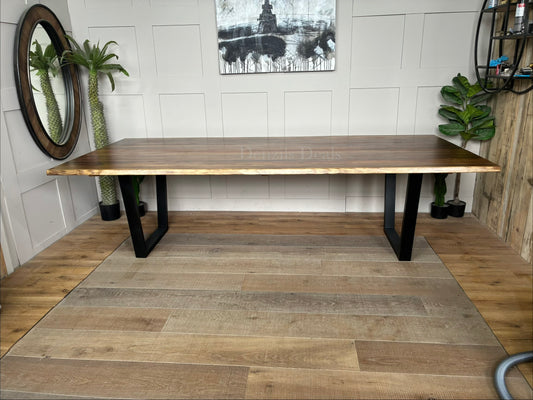 Rectangular Nick Scali Bartolo dining table with a live-edge Tasmanian Blackwood timber top and black metal sleigh legs.