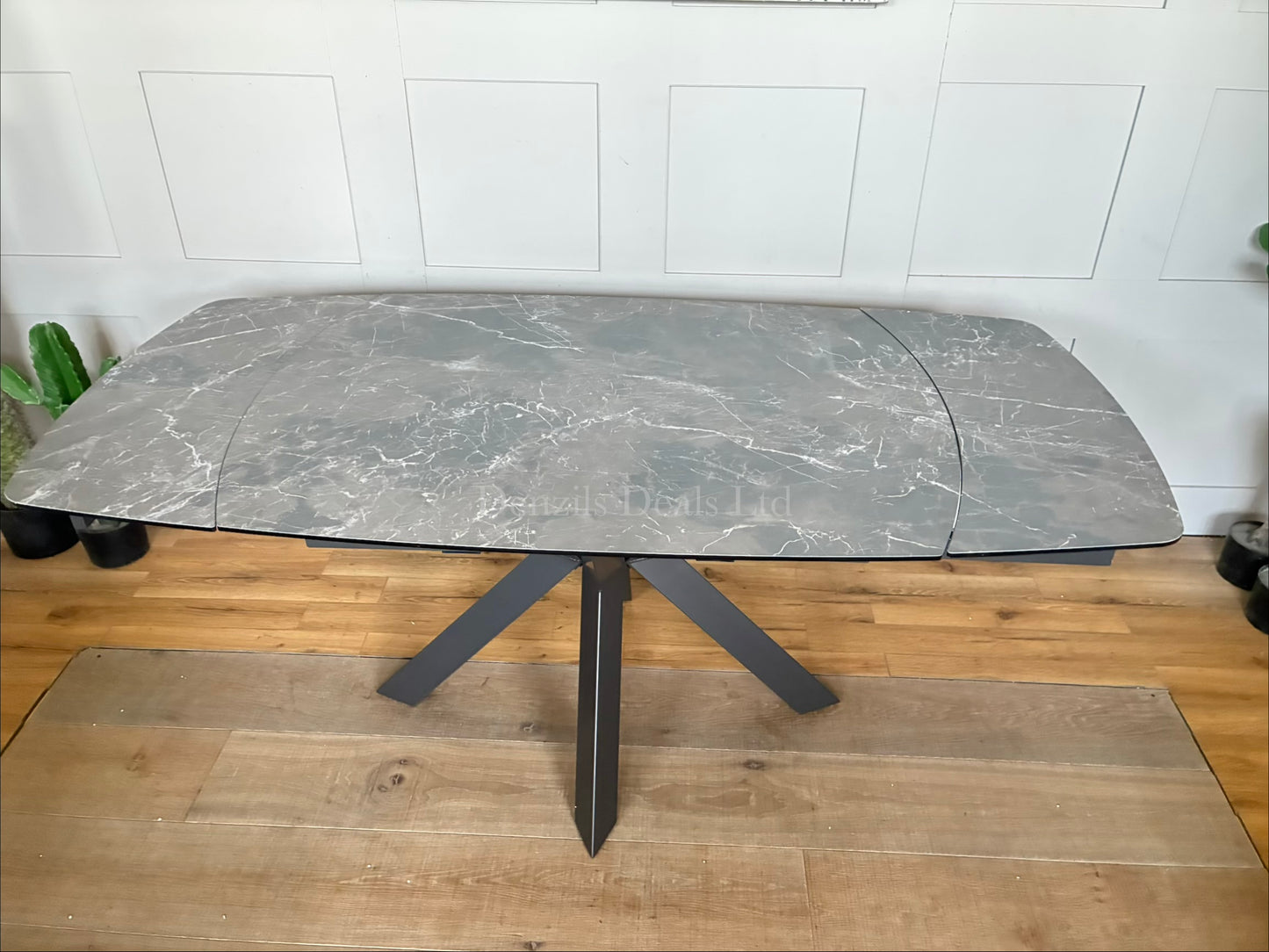 Rhodes Twist Top Extending Dining Table . The table surface smoothly rotates to automatically activate the extension panels, eliminating the need to store heavy loose leaves