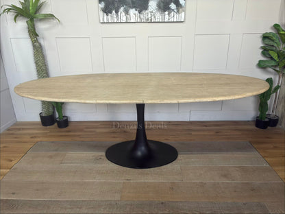 Richmond Interiors Hampton 8-seater dining table featuring a natural beige travertine stone oval top and modern black iron pedestal."