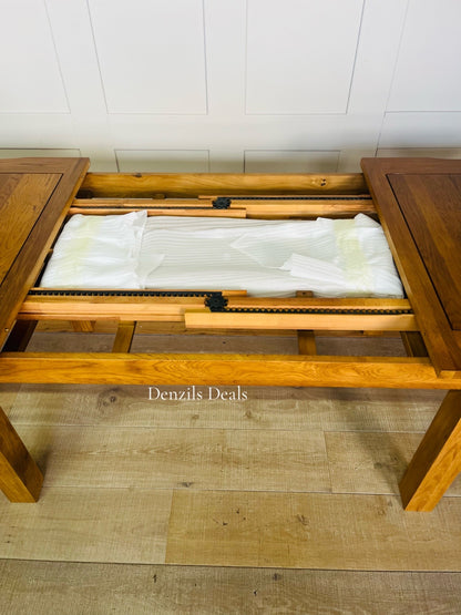 Solid Oak 6-8 Seater Extending Dining Table Rushmere Rustic  OakFurnitureland, close up view on the extension leafs