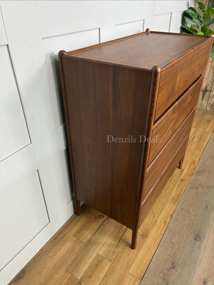 John Lewis Scandi 5 Drawer Wood Chest, Walnut Finish with five storage drawers and the top surface has a slight tray-edge design so your bedside essentials stay secure. Rounded posts, tapered legs and sleek, handle-less drawers all honour Scandinavian design principles, so it's perfect for keeping your bedroom a calm, uncluttered and simple space.