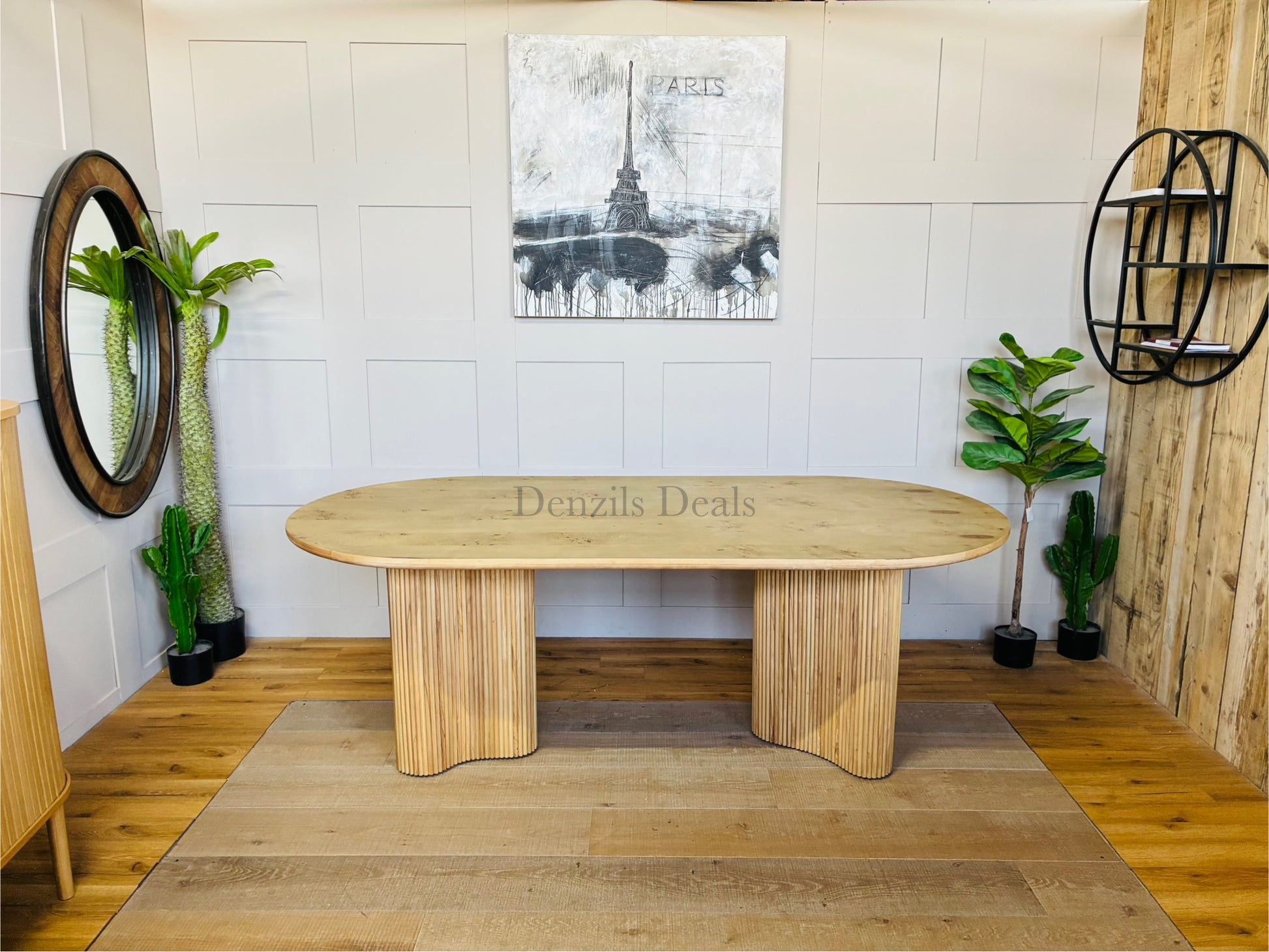 Anthropologie Scout dining table in light ash wood, featuring a decorative veneer top and a chunky, fluted base."
