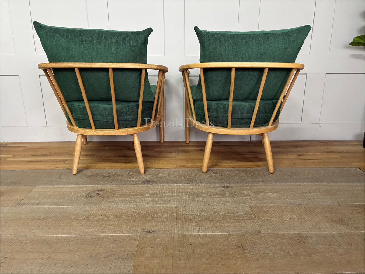 Set of two John Lewis Frome armchairs in forest green fabric with visible wood frames.
