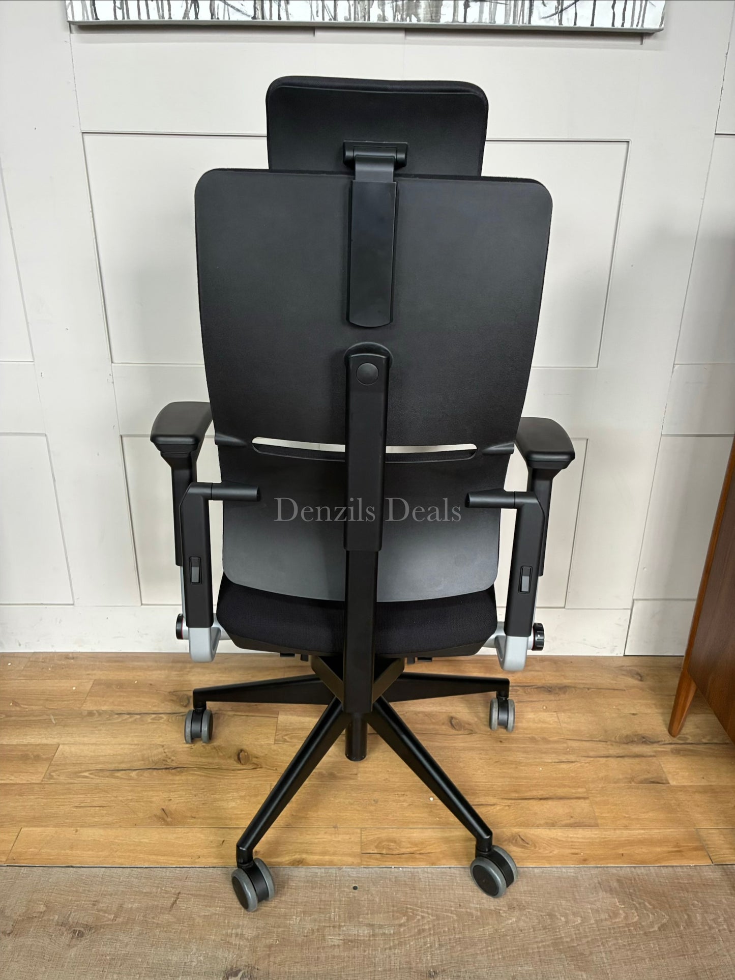 High-back Steelcase Please ergonomic office chair featuring a two-piece flexible backrest, fully adjustable armrests, and a matching fabric headrest.
