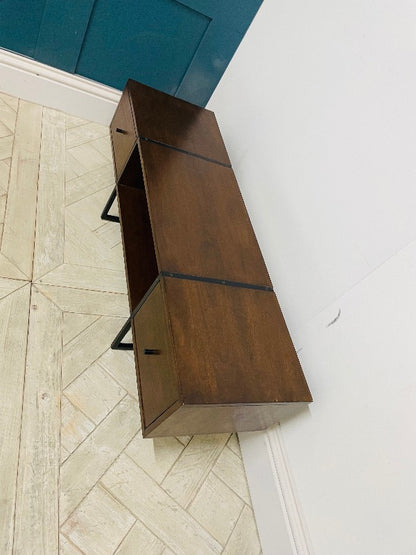Mid-century style walnut media unit by Swoon, featuring a rich wood grain, three storage drawers, and brass-tipped legs against a neutral background.