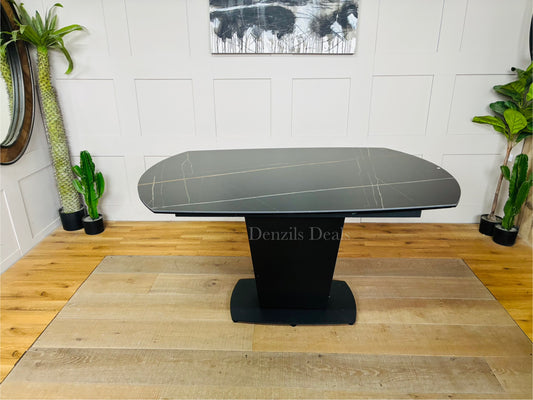 The Dwell Tabula Black Ceramic Marble Effect Extending Dining Table measures 150cm extending to 220cm, featuring a durable, heat- and stain-resistant black ceramic surface with a marble effect.