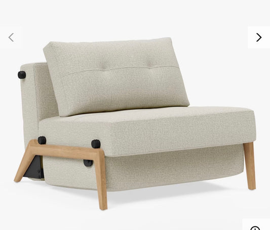 The Innovation Living Cubed 90 Armchair Bed in Mixed Dance Natural is a compact, Scandinavian-designed convertible chair that folds out into a single 90x200 cm sleeper