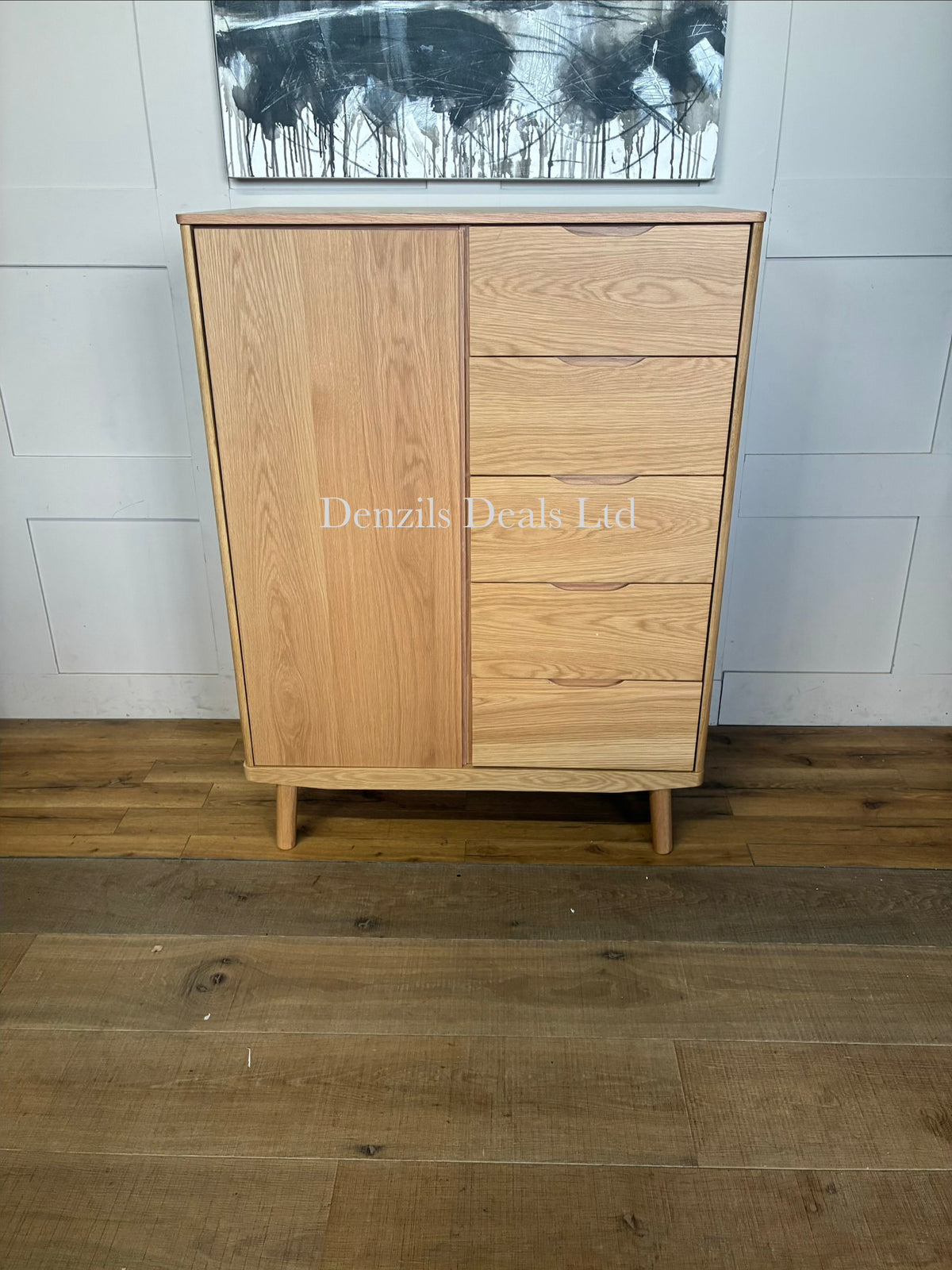 The John Lewis Bow 5 Drawer Low Wardrobe, Natural is a compact, modern freestanding bedroom unit crafted predominantly from solid oak and veneers, showcasing a natural wood grain finish
