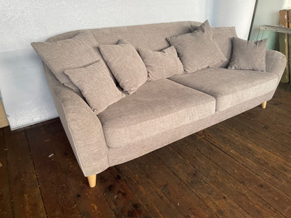 The John Lewis Laze medium 3-seater sofa in Opal Putty, styled in a bright, modern living room with coordinating neutral scatter cushions