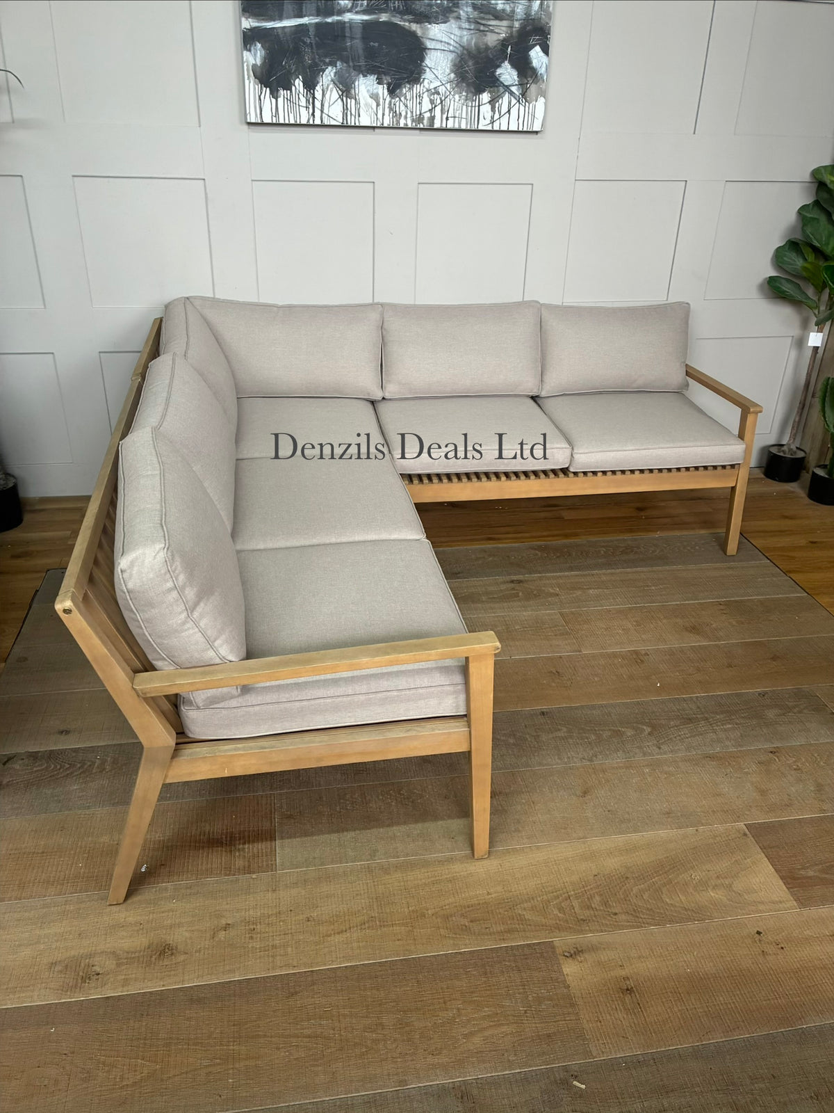 The John Lewis Mona 4-Seater Corner Garden Sofa features a contemporary slatted design made from sustainably sourced, weather-resistant FSC-certified acacia wood
