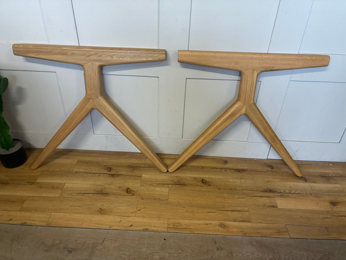 The John Lewis Poise 6-10 Seater Extending Dining Table is a Scandi-inspired, rectangular oak table designed with rounded edges and splayed legs, featuring a lacquer finish to highlight the natural grain. It extends to accommodate 10 people, offering a sturdy, modern look.