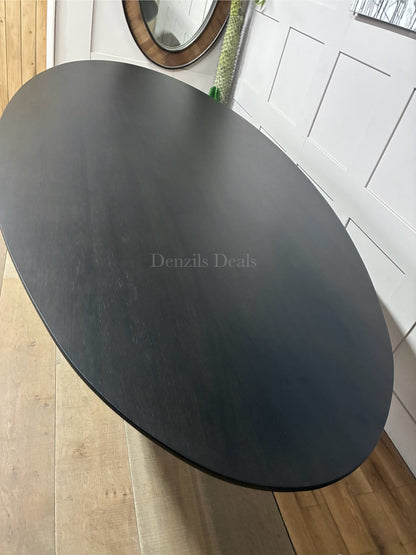 The Richmond Interiors Gordon Dining Table in Dark Coffee wood with a modern black metal structural base."