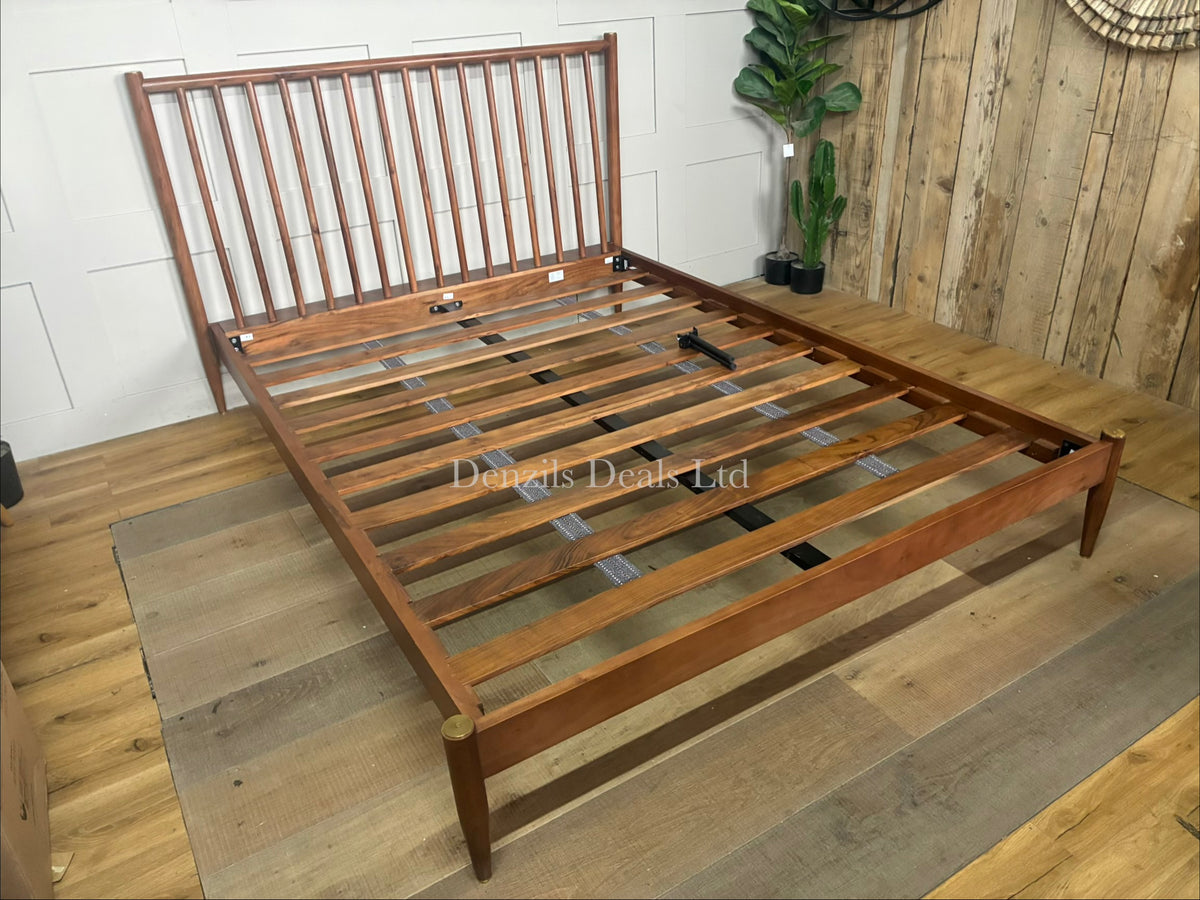The Swoon Cartwright king-size bed frame in dark brown acacia wood. The bed combines traditional spoked styling with sleek contemporary lines, showcasing a high headboard with clean vertical slats and slim legs.