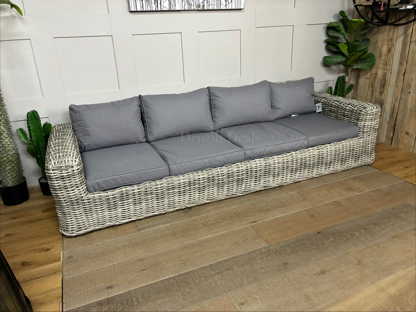 Three-seater garden sofa from the Gallery Direct Ragusa collection, featuring a modern woven rattan frame and deep, padded cushions."