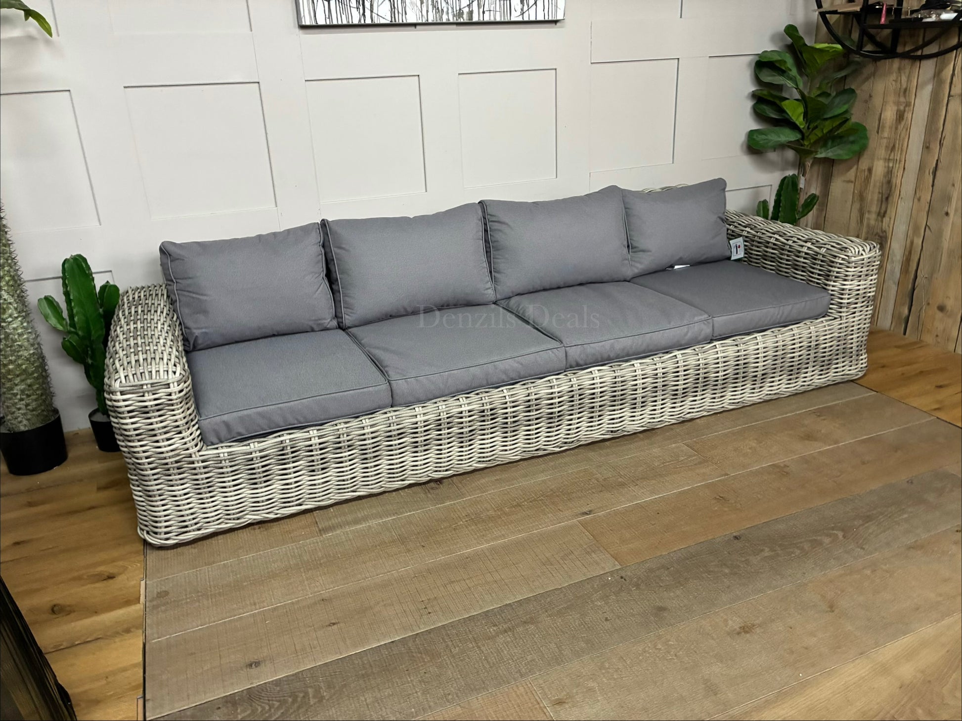 Three-seater garden sofa from the Gallery Direct Ragusa collection, featuring a modern woven rattan frame and deep, padded cushions."