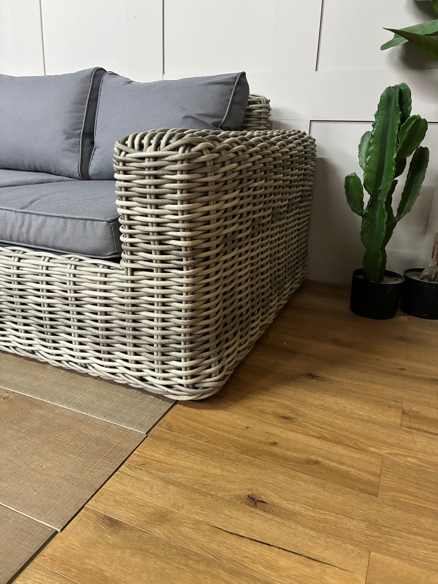 Three-seater garden sofa from the Gallery Direct Ragusa collection, featuring a modern woven rattan frame and deep, padded cushions."