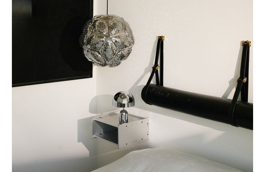  Tom Dixon Puff Pendant Light pendant light A round, geometric stainless steel pendant light with an intricate, perforated surface.