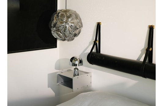  Tom Dixon Puff Pendant Light pendant light A round, geometric stainless steel pendant light with an intricate, perforated surface.