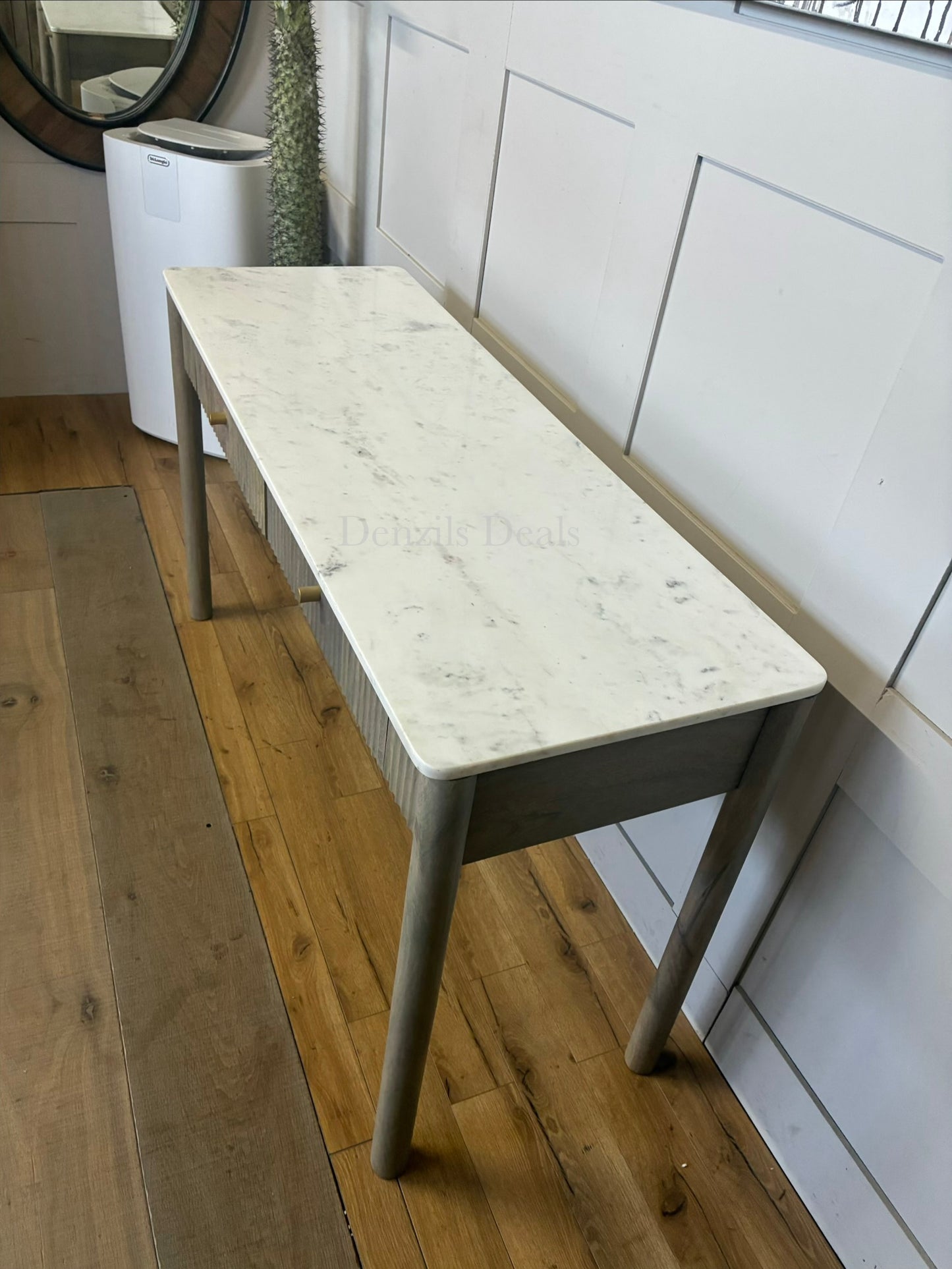 Marmo Marble Top 2 Drawer Console Table with a polished white Indian Carrera marble surface with unique grey and blue veining, Crafted from solid mango wood with a grey-wash finish, two drawers feature striking vertical ribbed textures that provide architectural depth. Finished with elegant round button knobs, typically in brass or gold-toned metal