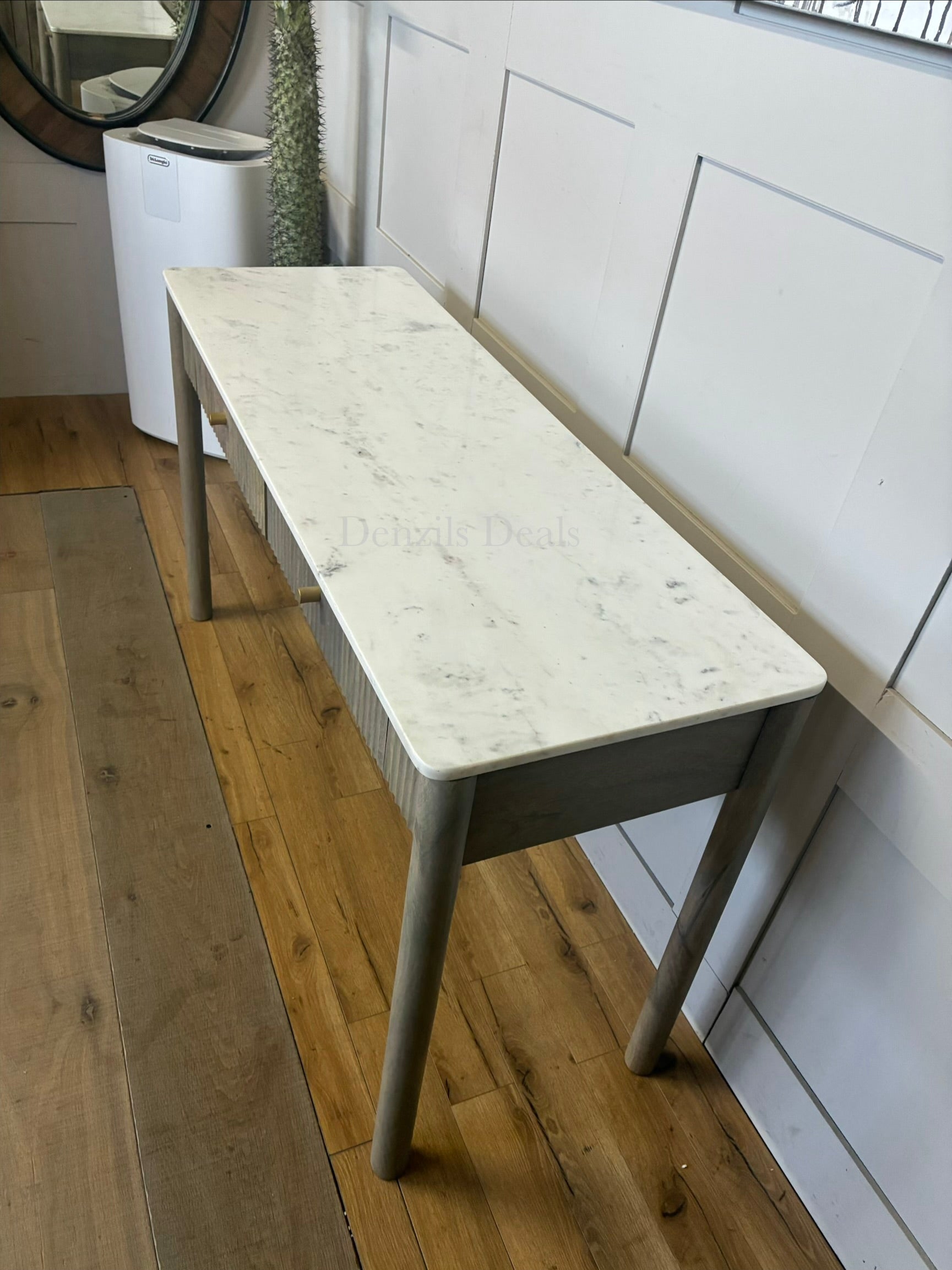 Marmo Marble Top 2 Drawer Console Table with a polished white Indian Carrera marble surface with unique grey and blue veining, Crafted from solid mango wood with a grey-wash finish, two drawers feature striking vertical ribbed textures that provide architectural depth. Finished with elegant round button knobs, typically in brass or gold-toned metal
