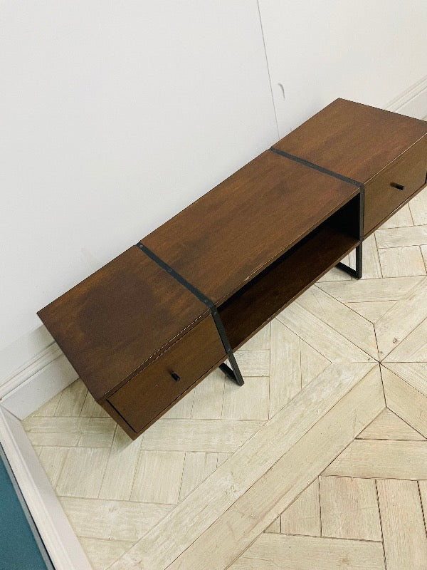 Mid-century style walnut media unit by Swoon, featuring a rich wood grain, three storage drawers, and brass-tipped legs against a neutral background. Top view