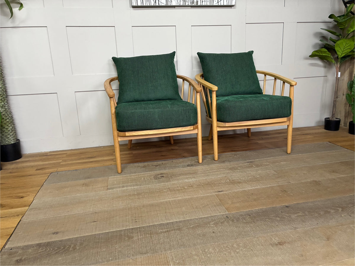 Two John Lewis Frome armchairs upholstered in textured forest green fabric, featuring a solid oak wood frame, curved backrest, and supportive foam-and-fibre cushions