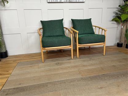 Two John Lewis Frome armchairs upholstered in textured forest green fabric, featuring a solid oak wood frame, curved backrest, and supportive foam-and-fibre cushions