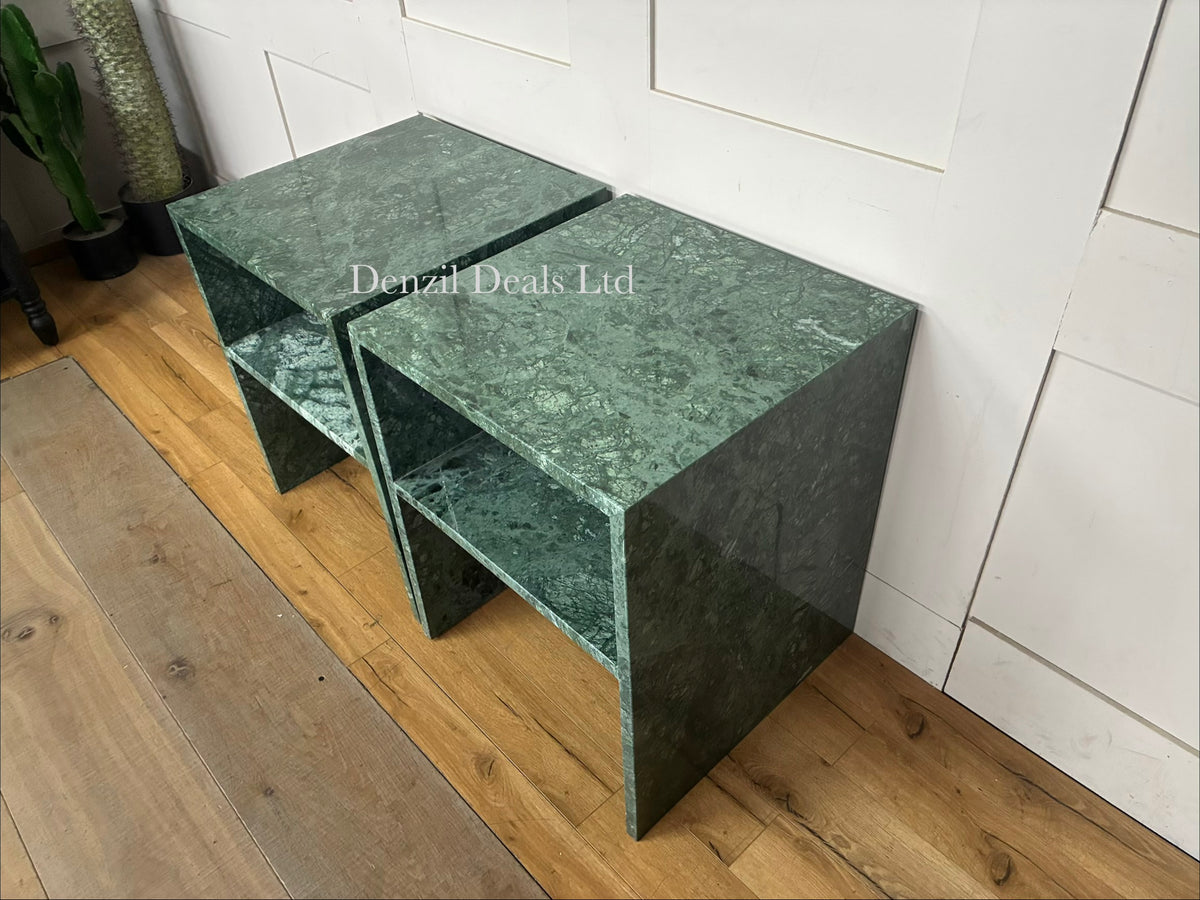 Two matching Anthropologie Gia open-style side tables made of polished pure marble, showcasing natural grey veining in green , smooth block tabletops, and open architectural, column-like legs