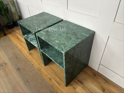 Two matching Anthropologie Gia open-style side tables made of polished pure marble, showcasing natural grey veining in green , smooth block tabletops, and open architectural, column-like legs