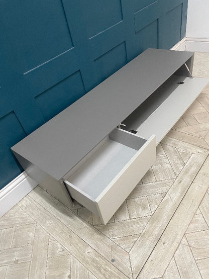 Wave embossed effect on the taupe drawer fronts of the Dante TV unit by John Lewis & Partners