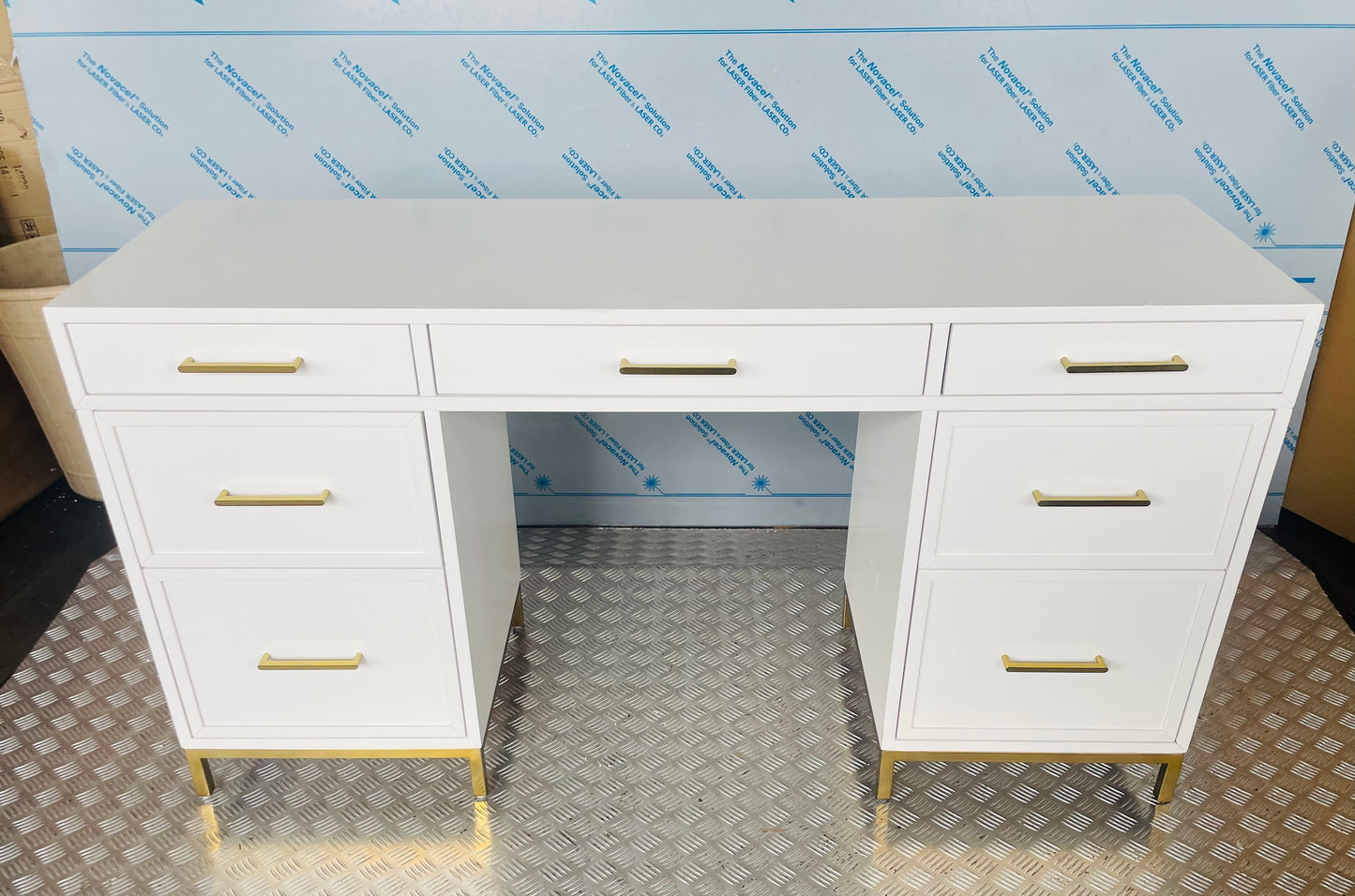 White Blaire smart storage desk featuring a flat top, symmetrical multi-drawer design, and gold drawer pulls