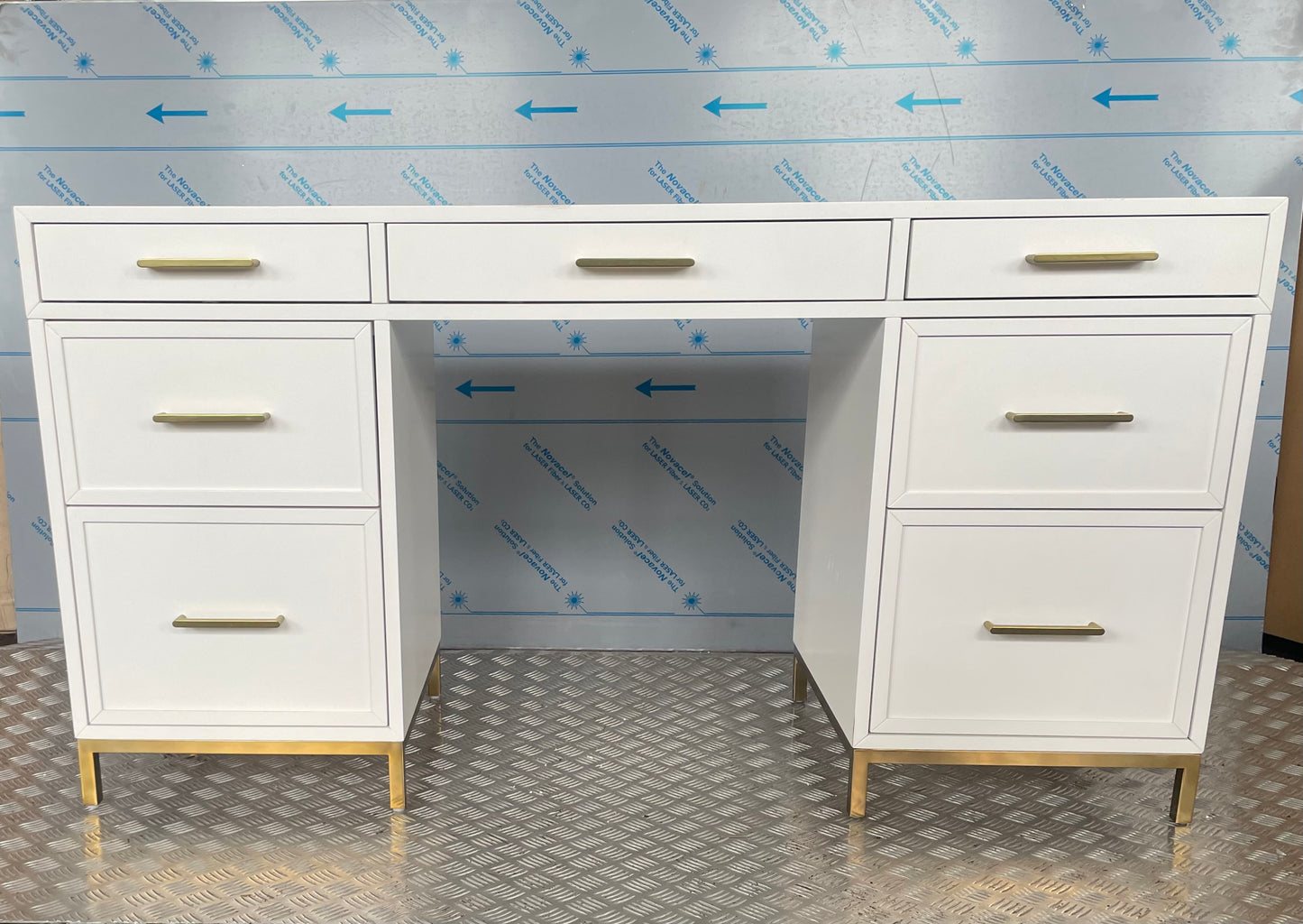 White Blaire smart storage desk featuring a flat top, symmetrical multi-drawer design, and gold drawer pulls